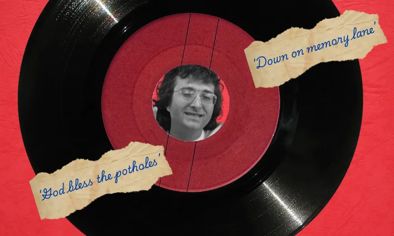 A large vinyl with a black and white photo of a face in the middle (the face is Randy Newman). There are strips of paper with lyrics written down on top of the vinyl.