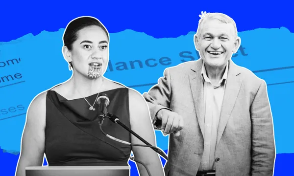 A woman with a traditional chin moko speaks at a podium, while an older man in a suit stands beside her, smiling. The background is blue with torn paper and faint text.
