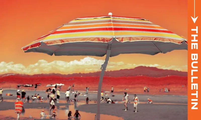 A large striped beach umbrella shades a crowded beach scene with people. The sky and landscape have an orange-red tint. "THE BULLETIN" is written vertically on the right side of the image.