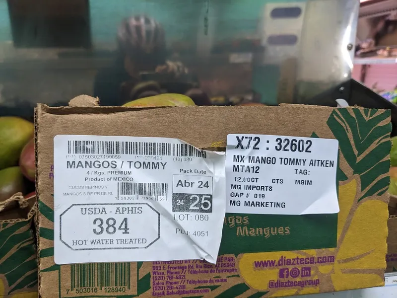 label on a box of tommy atkins mangoes showing that they have been heat treated