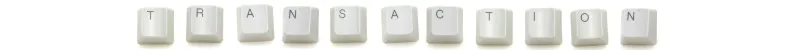 the word 'transaction' on computer keys