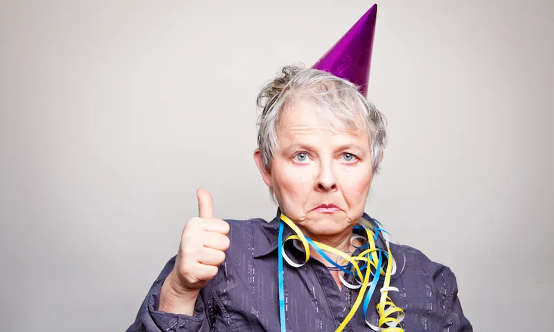 depressed senior woman doing thumbs up