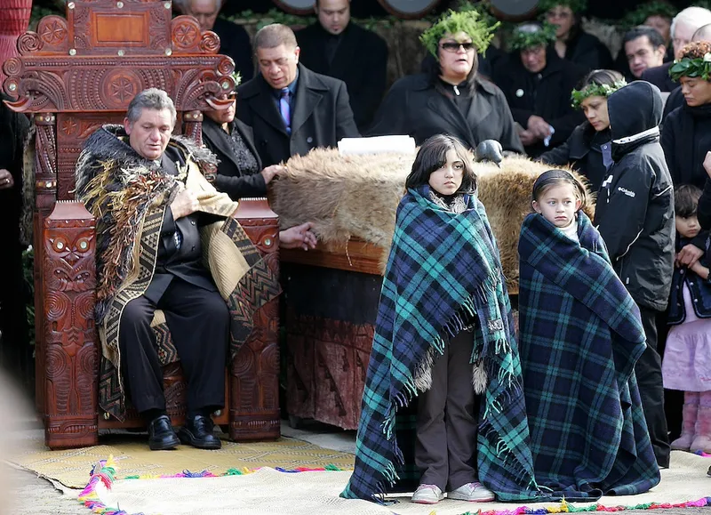 New Maori King Tuheitia Paki (L) sits on