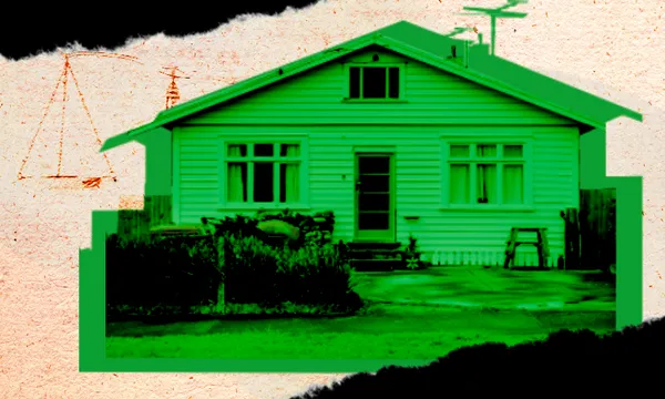 a green tinged bungalow with rips around it looking a bit threatening