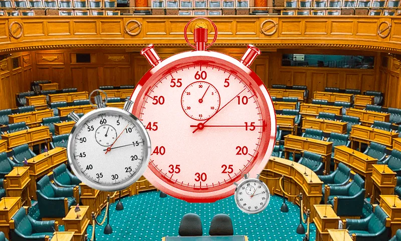 the green interior of parliament with big alarm clocks