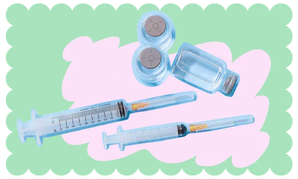 Covid-19 vaccine syringes and vials atop a light pink and green background.