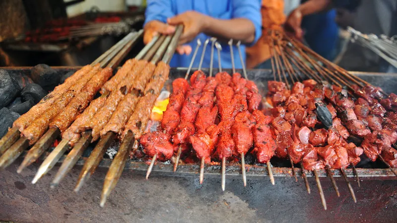 An Indian Muslim vendor grills meat keba