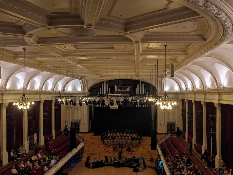 auckland town hall ft. a kapa haka group in yellow and black