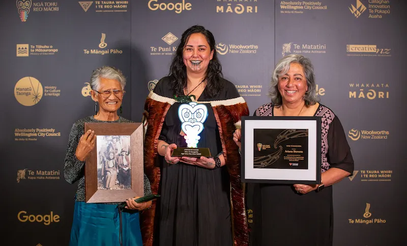 Ariana Stevens and two members of her whānau smile for the camera at the Ngā Tohu Reo Māori awards.