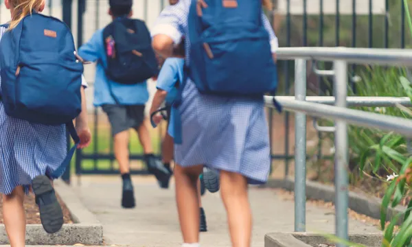 School children walking away.