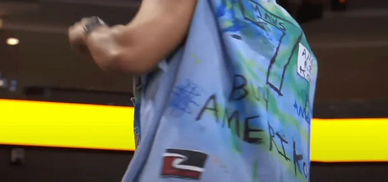 An upcycled blue shirt featuring the number '7' and a several Dallas Mavericks references, plus the Tino Rangatiratanga flag.