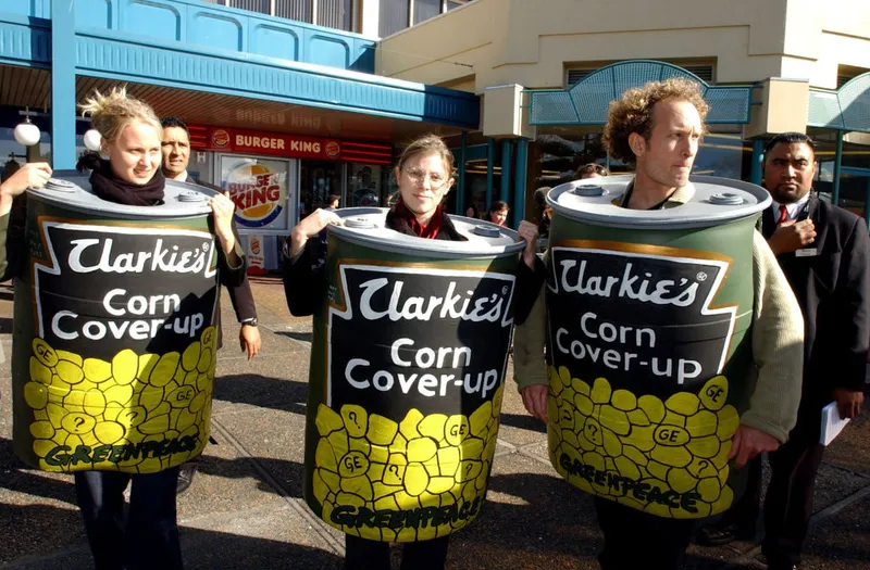 Greenpeace Corn Cans get taken away by security wh
