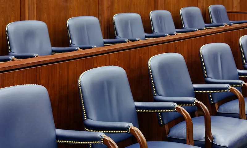 Empty Jury Seats in Courtroom