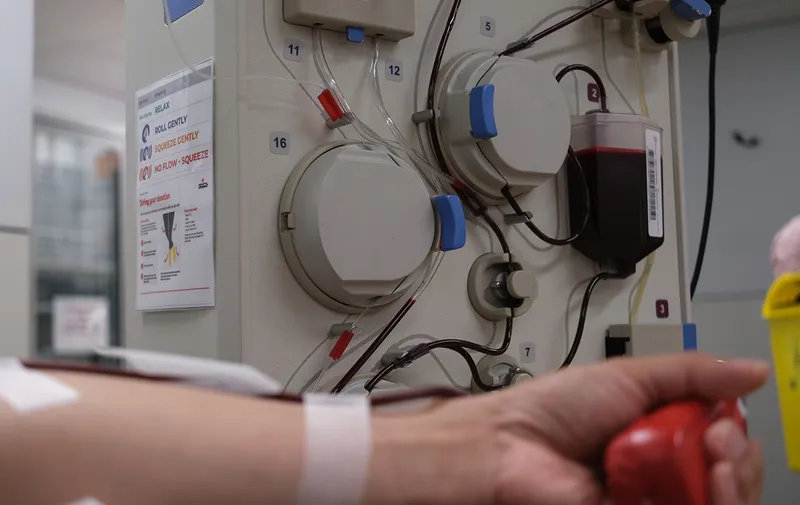 Hands donating blood plasma at  Blood Donor centre.