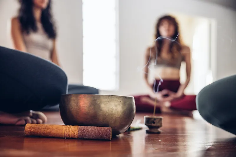Tibetan singing bowl close up during a meditation group class