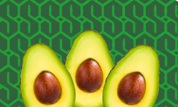 Three avocado halves with brown seeds are arranged in the foreground against a dark green background with a geometric pattern.