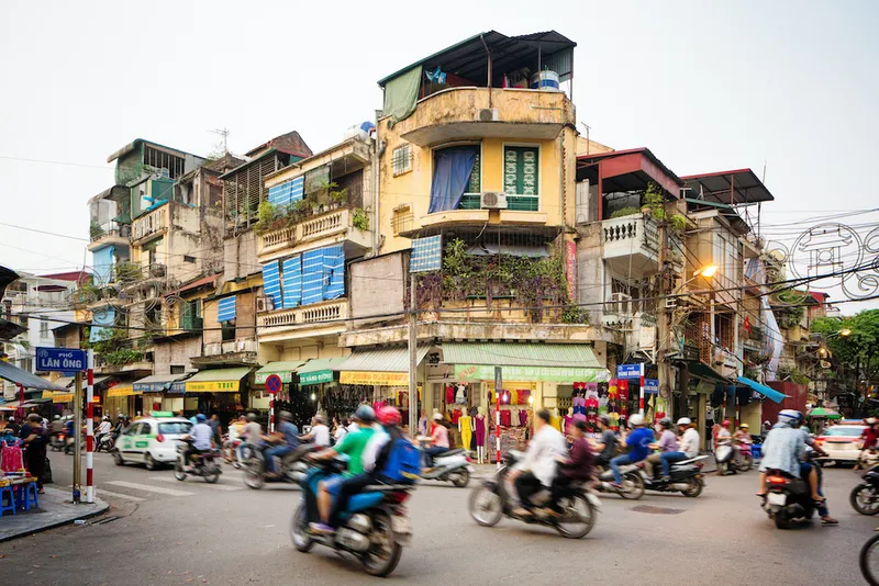 Busy street corner in old town Hanoi Vietnam