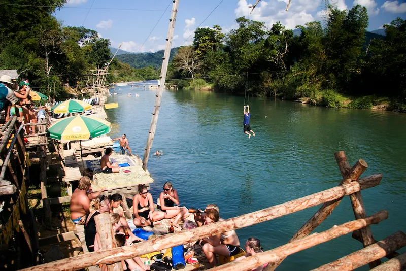 Tourists by river.