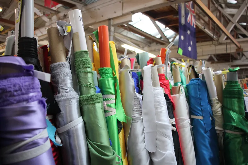 rolls of fabric in many colours