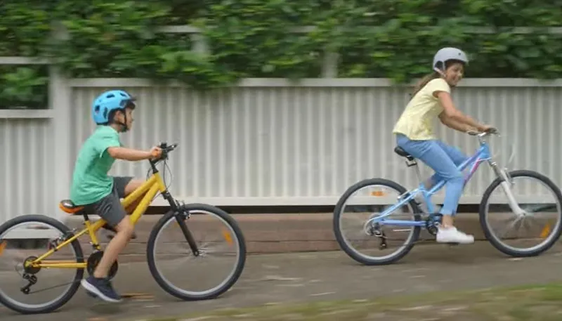 Kids illegally riding bikes on the footpath