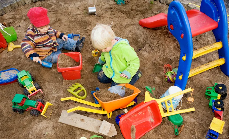 A child playing in a sandpit Sweden.