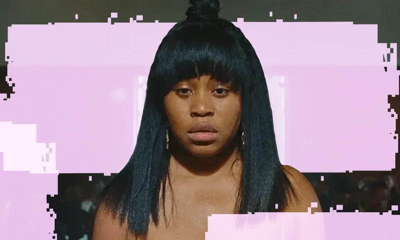 The lead star in Swarm, Dominique Fishback, stares at the camera.
