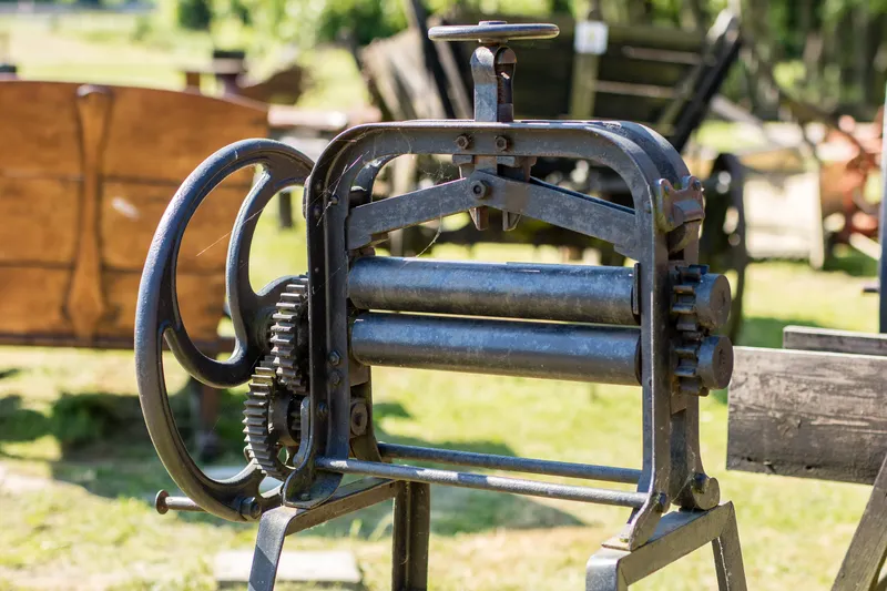 Old mangle for housework. Devices that facilitate housework in an old house. Season of the spring.