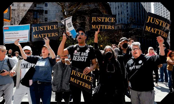 Opponents of former US president Donald Trump protest outside the Manhattan District Attorney's office in New York City on April 4, 2023. - Former US president Donald Trump arrived for a historic court appearance in New York on Tuesday, facing criminal charges that threaten to upend the 2024 White House race.
