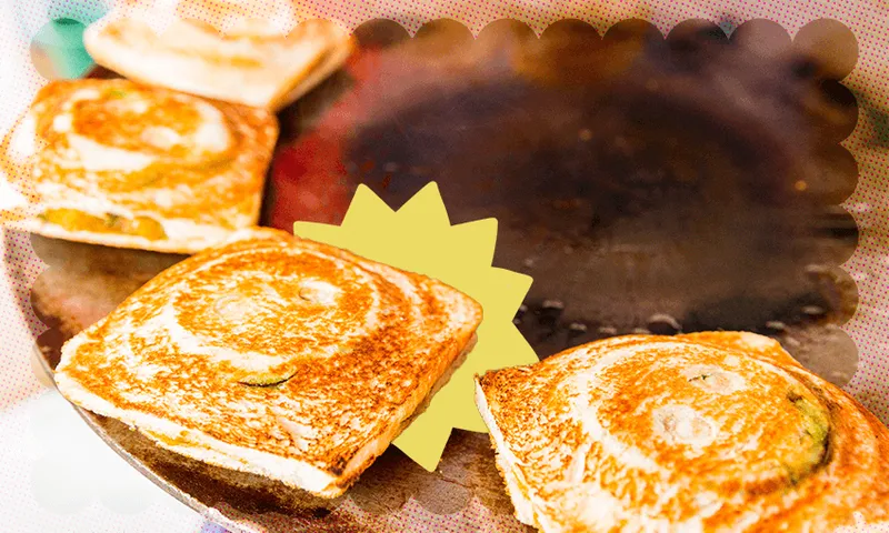 Bombay sandwiches frying at a street stall