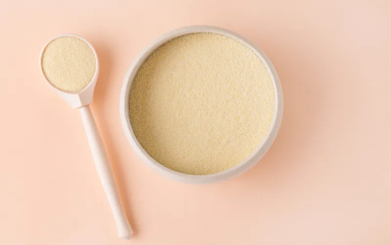 Collagen powder in jar and measure spoon.