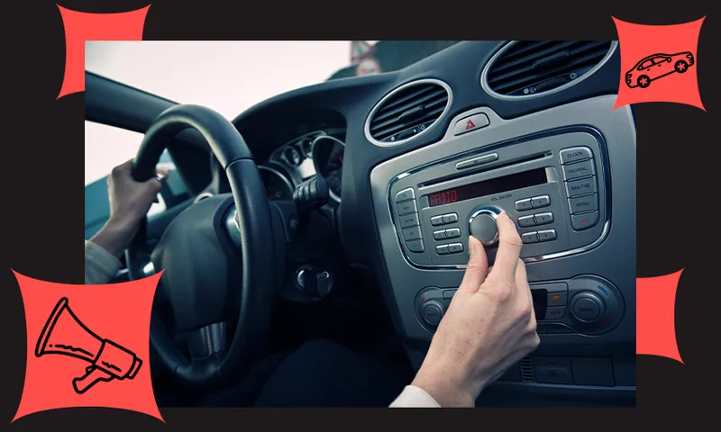 driver tuning a car radio