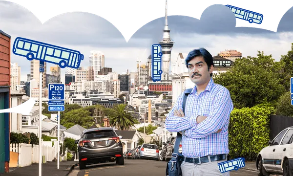 a grumpy looking brown skinned man with a very impressive moustache and the sky tower and buses in the background