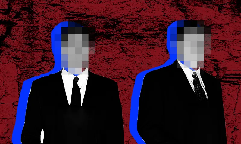 two men wearing suits and with blurred faces stand in front of a red bakcground