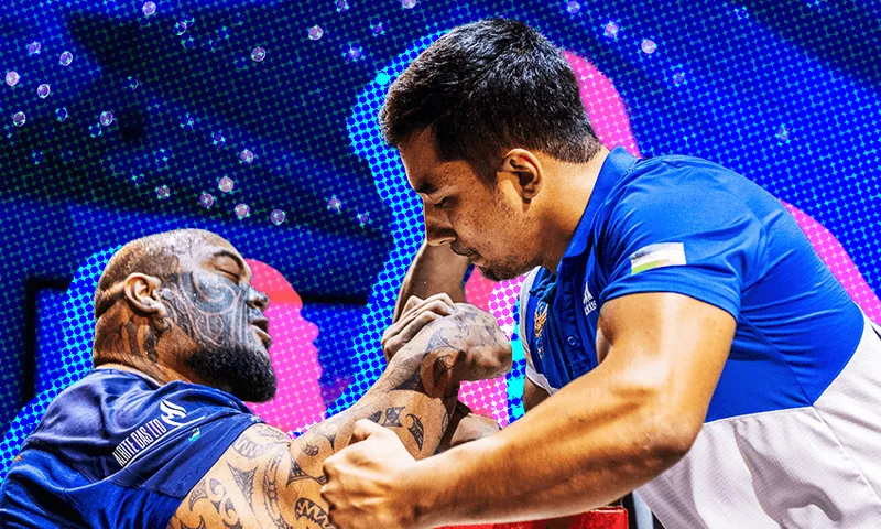 The arm wrestler known as 'The Beast' - left - takes on a competitor.