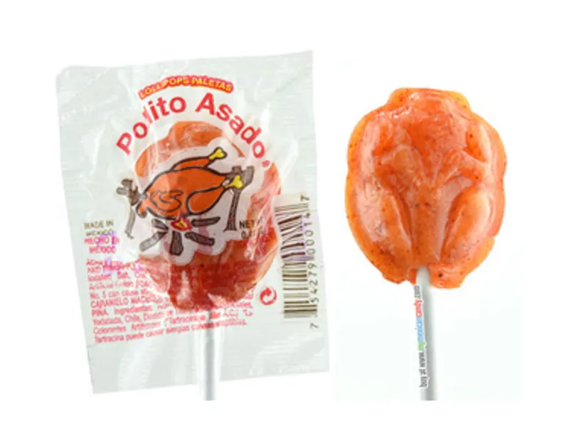 A Mexican lollipop shaped like a roast chicken and orange coloured.