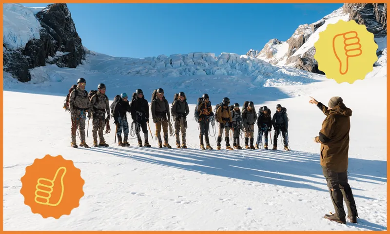 The teams of Tracked stand on the snowy slopes of a mountain