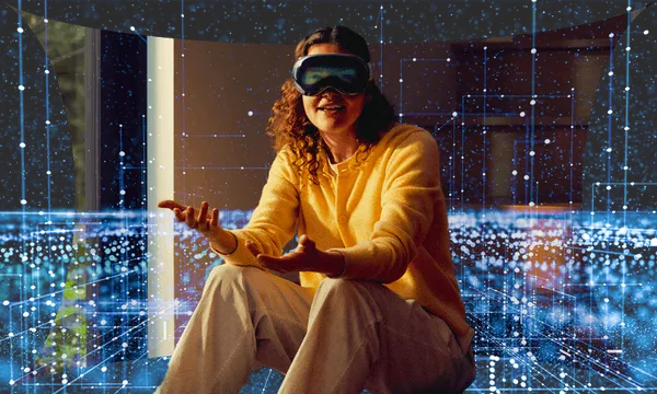 A woman wears Apple new headset, the Vision Pro.