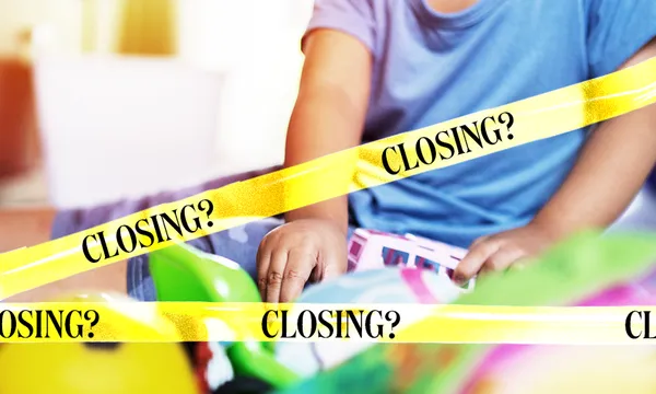 a kid with some toys and yelow tapreading "closing?" over the picture