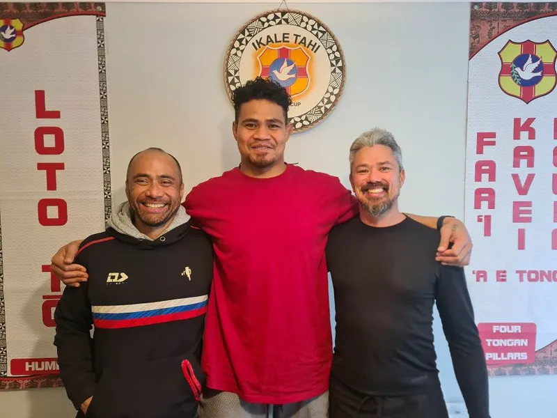 Charles Riechelmann on the left and Sebastian Hurrell on the right with an Ikale Tahi rugby player