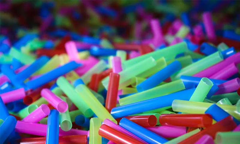 colourful plastic straws all piled up