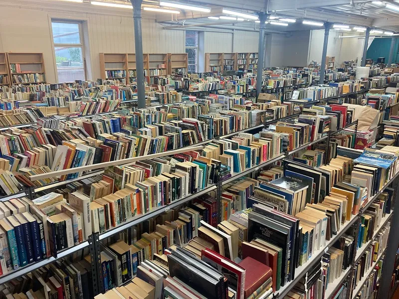 a very cluttered warehouse of books!