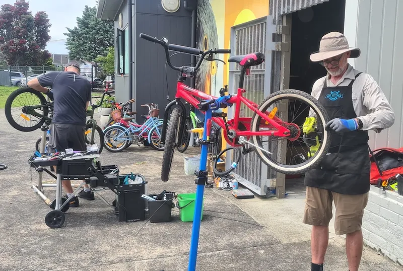 Richard Barter fixes bikes at Wesley Primary School.