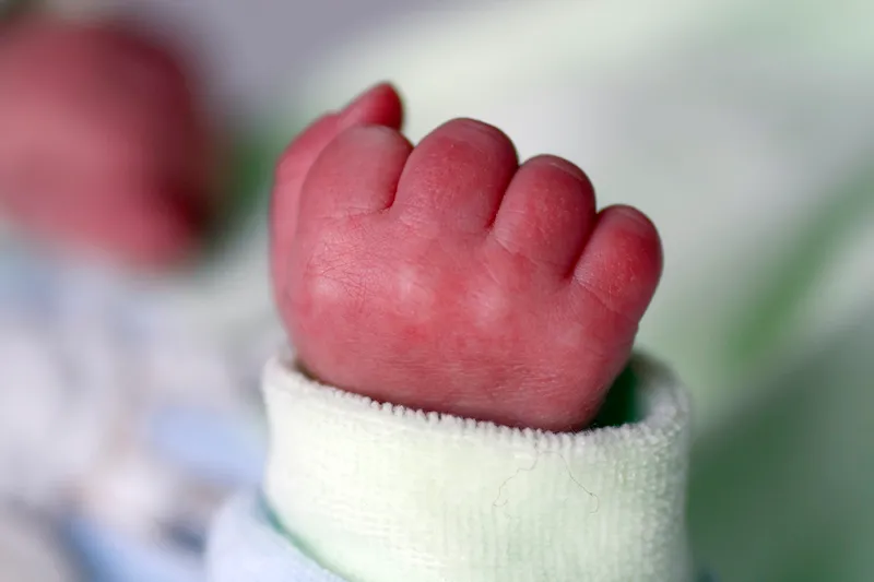 closed hand of a newborn baby