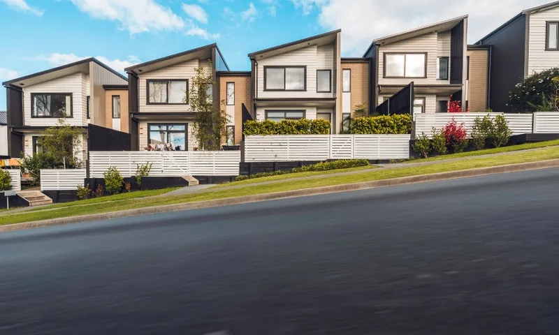 row of townhouses on street generic getty