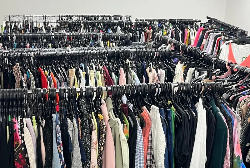 a room full of colourful clothes