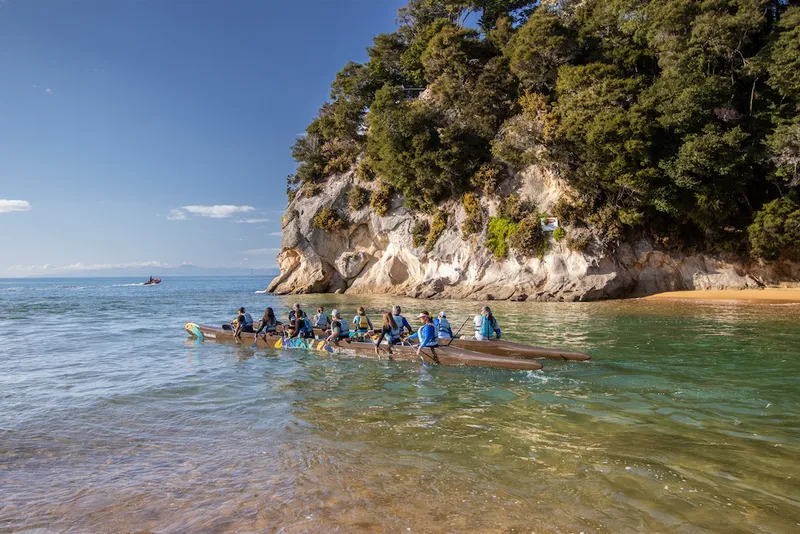 A photo of kayakers in the Abel Tasman national park.