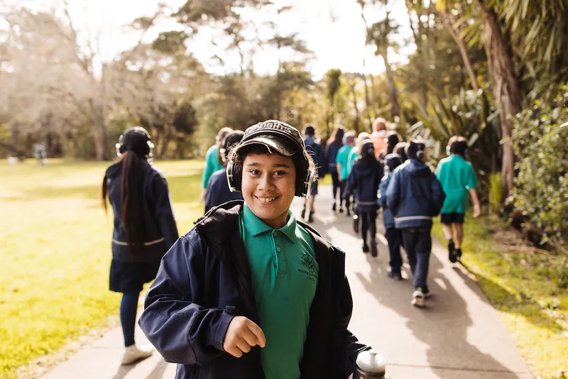 Ākonga from Henderson North Primary on a hīkoi at Henderson Park.