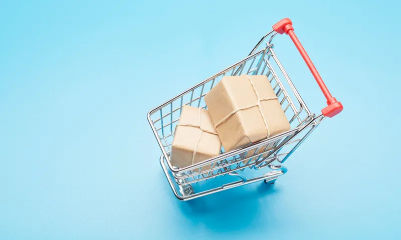 Still life of a small shopping cart and parcels