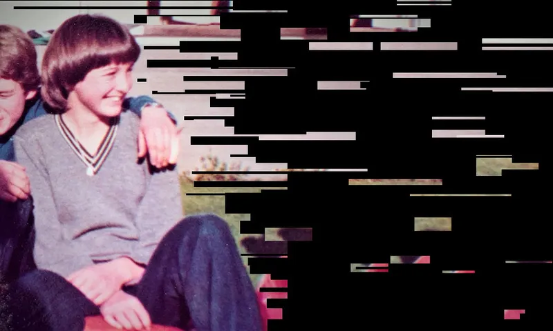 Photo of a young teen girl smiling, seated; to her right a boy sits close with an arm draped over her shoulder.