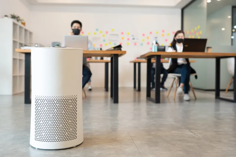Air purifier in modern office for fresh air and removal dust PM 2.5